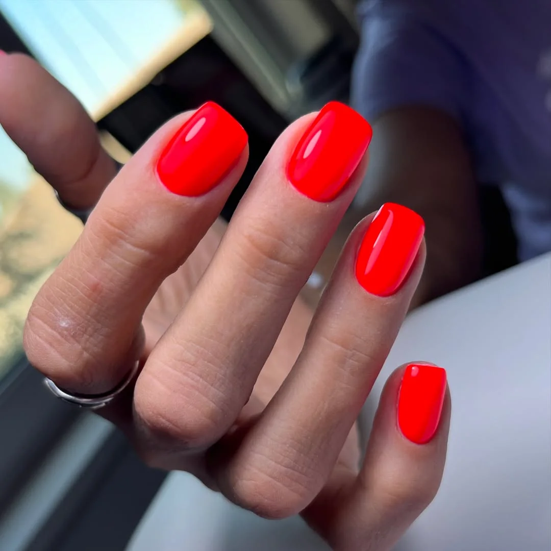 neon summer nails 2026 Glossy Neon Coral Nails For The Ultimate Summer Minimalist Look