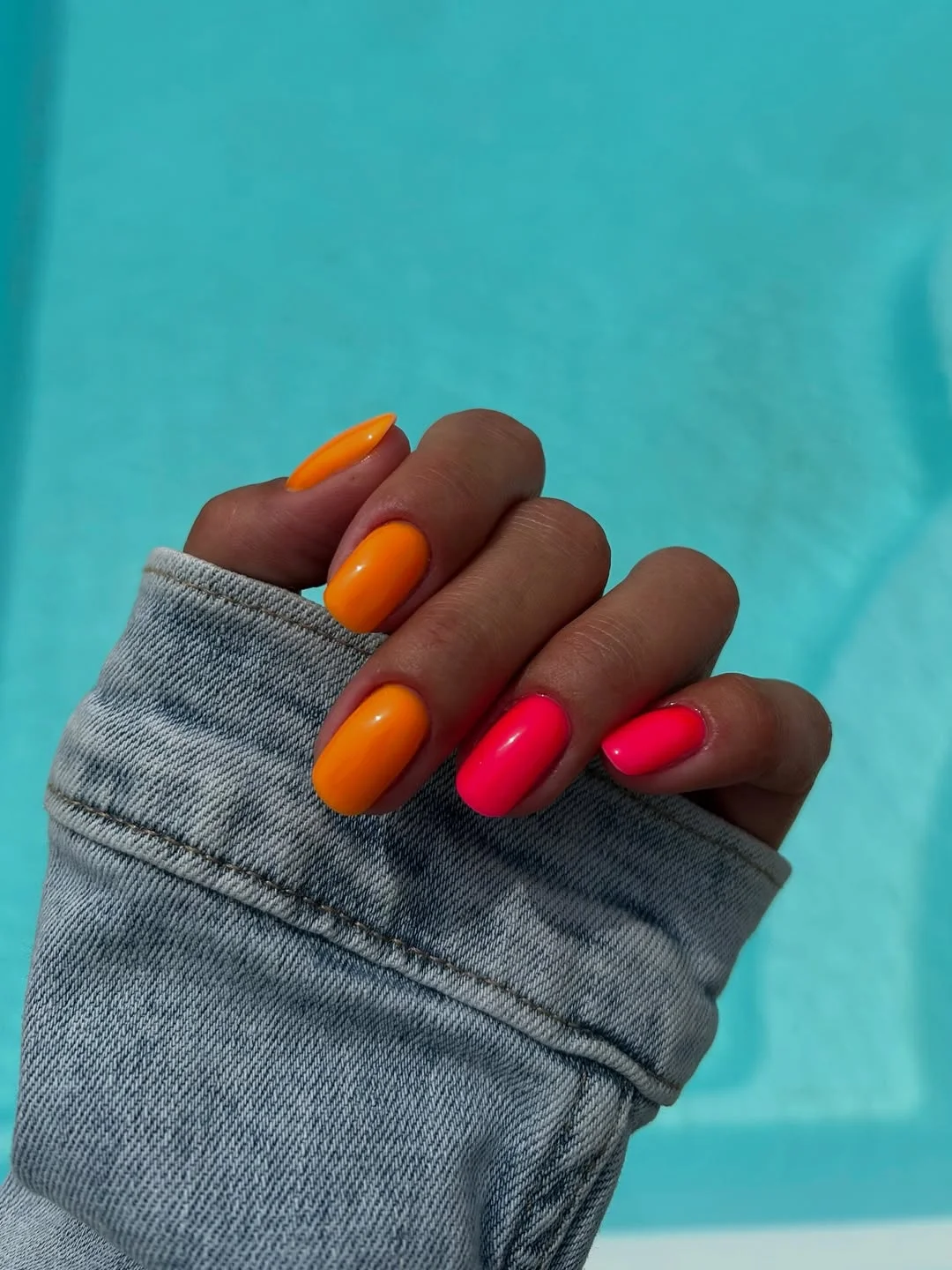 neon summer nails 2026 Bold Orange And Pink Color Block Nails For Poolside Energy