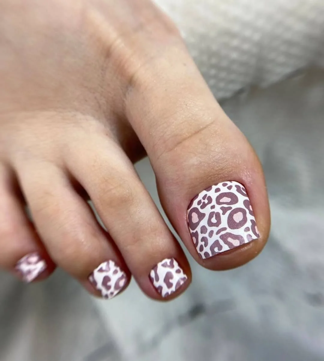 pedicure ideas - summer trends 2026 Soft Mauve Leopard Pedicure for a Playful Neutral Summer