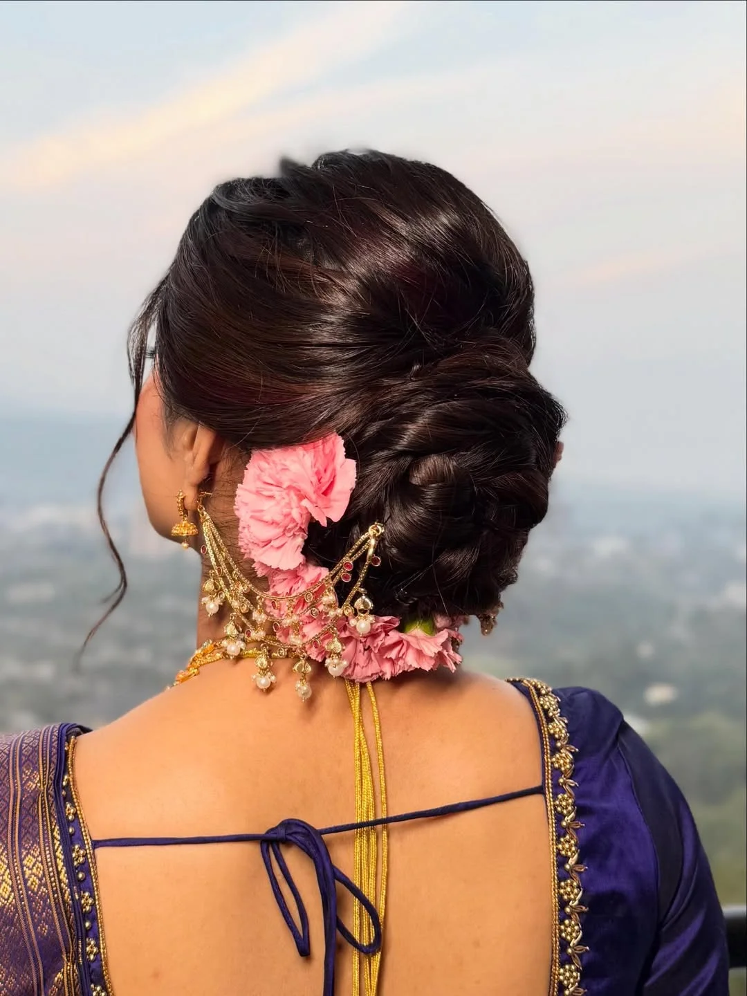 quick summer bun hairstyles 2026 Soft Floral Low Bun With Romantic Indian Details