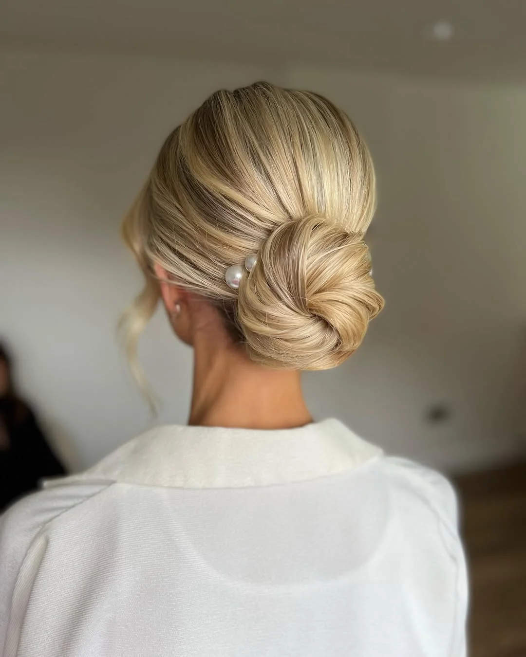 quick summer bun hairstyles 2026 Soft Pearl Blonde Bun With Clean Bridal Energy