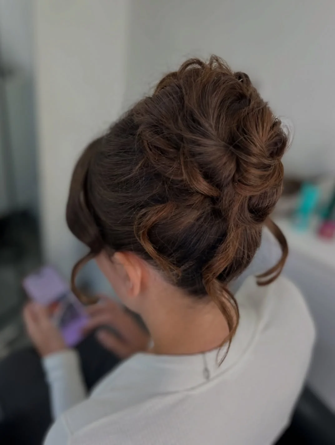 quick summer bun hairstyles 2026 Textured Voluminous Bun With Soft Curled Pieces