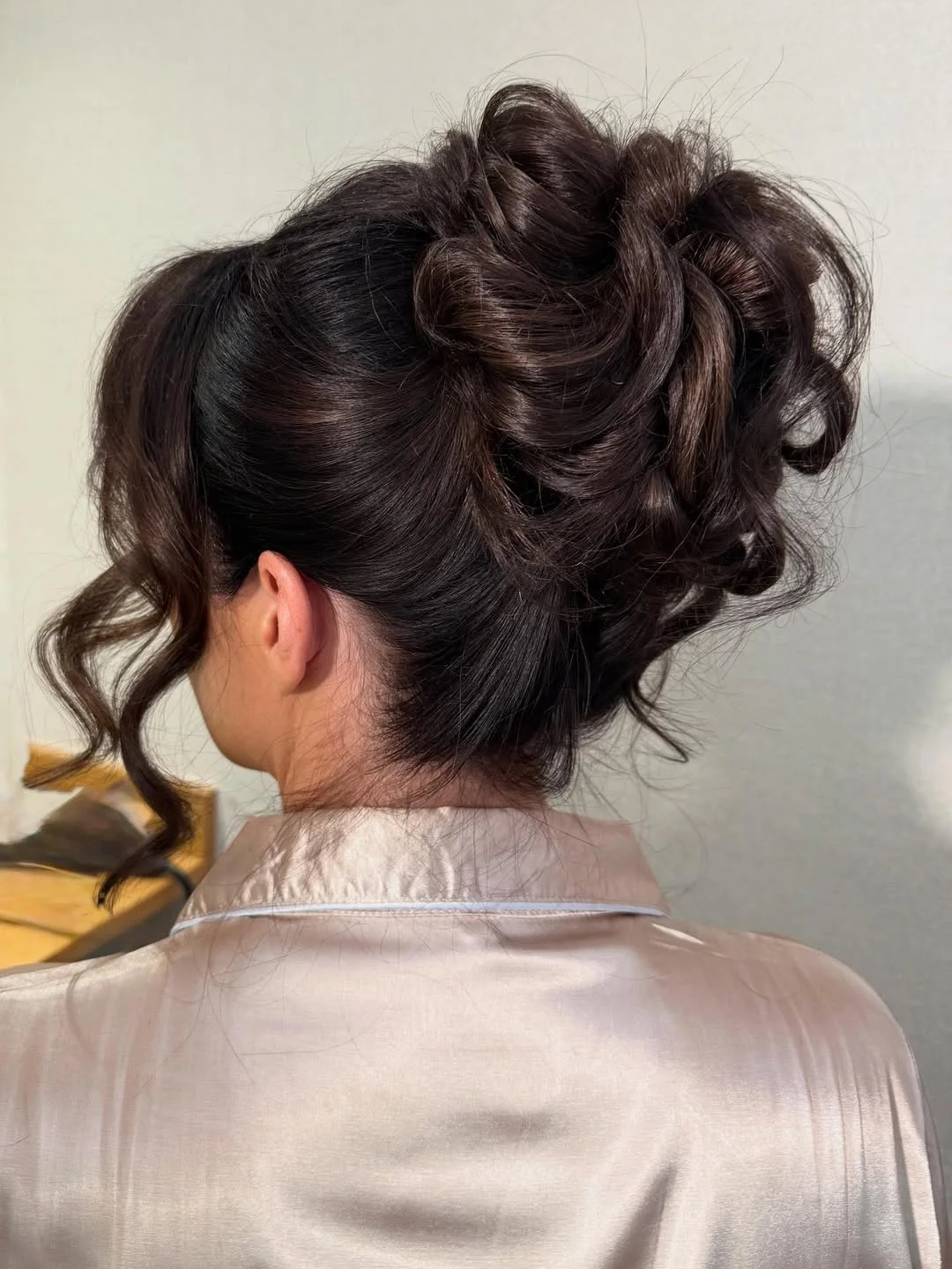 quick summer bun hairstyles 2026 Romantic High Bun With Soft Curly Texture