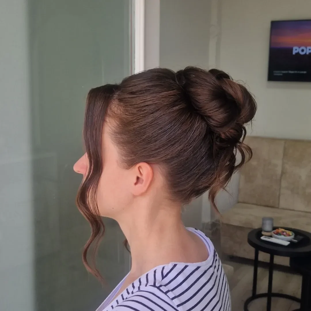 quick summer bun hairstyles 2026 Soft High Bun With Loose Summer Tendrils