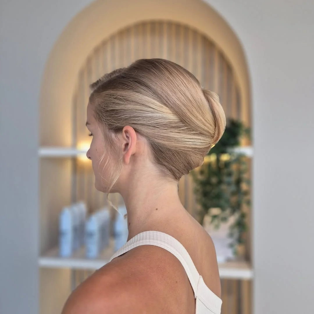 quick summer bun hairstyles 2026 Sleek Blonde Bun With Smooth Scandinavian Finish