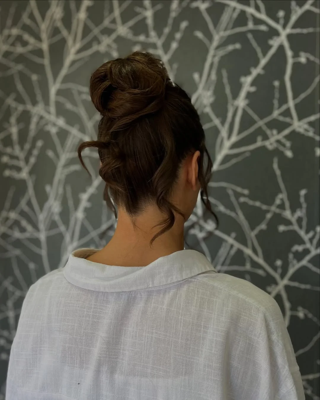 quick summer bun hairstyles 2026 Relaxed Top Knot With Romantic Curled Pieces