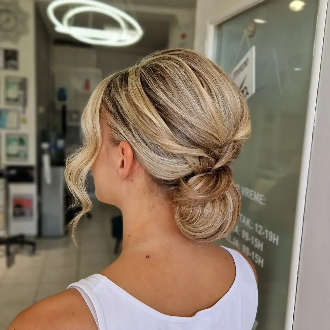 quick summer bun hairstyles 2026 Elegant Twisted Blonde Bun With Soft Summer Volume