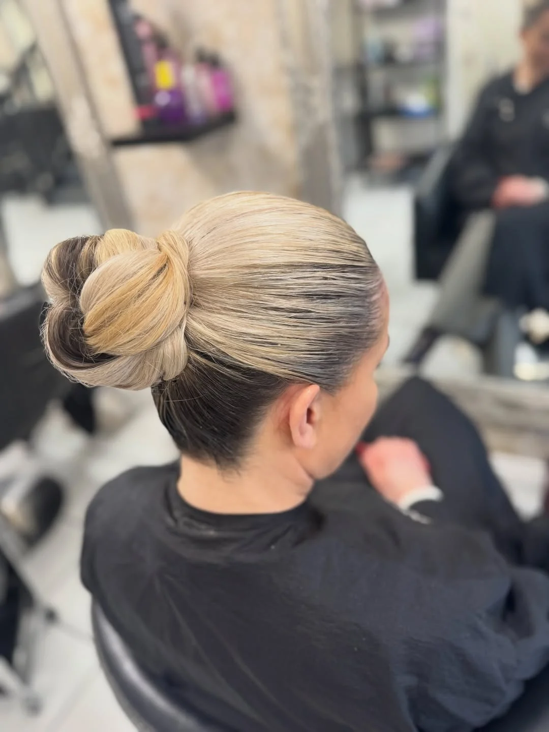 quick summer bun hairstyles 2026 Sleek Wrapped Bun With High-Gloss Finish