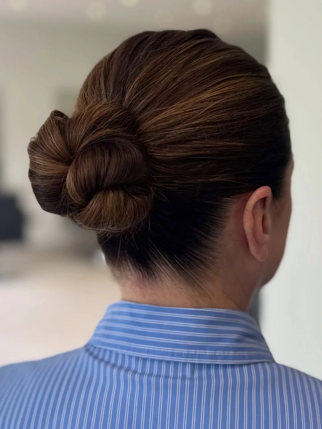 quick summer bun hairstyles 2026 Polished Office Bun With Smooth Sculpted Volume