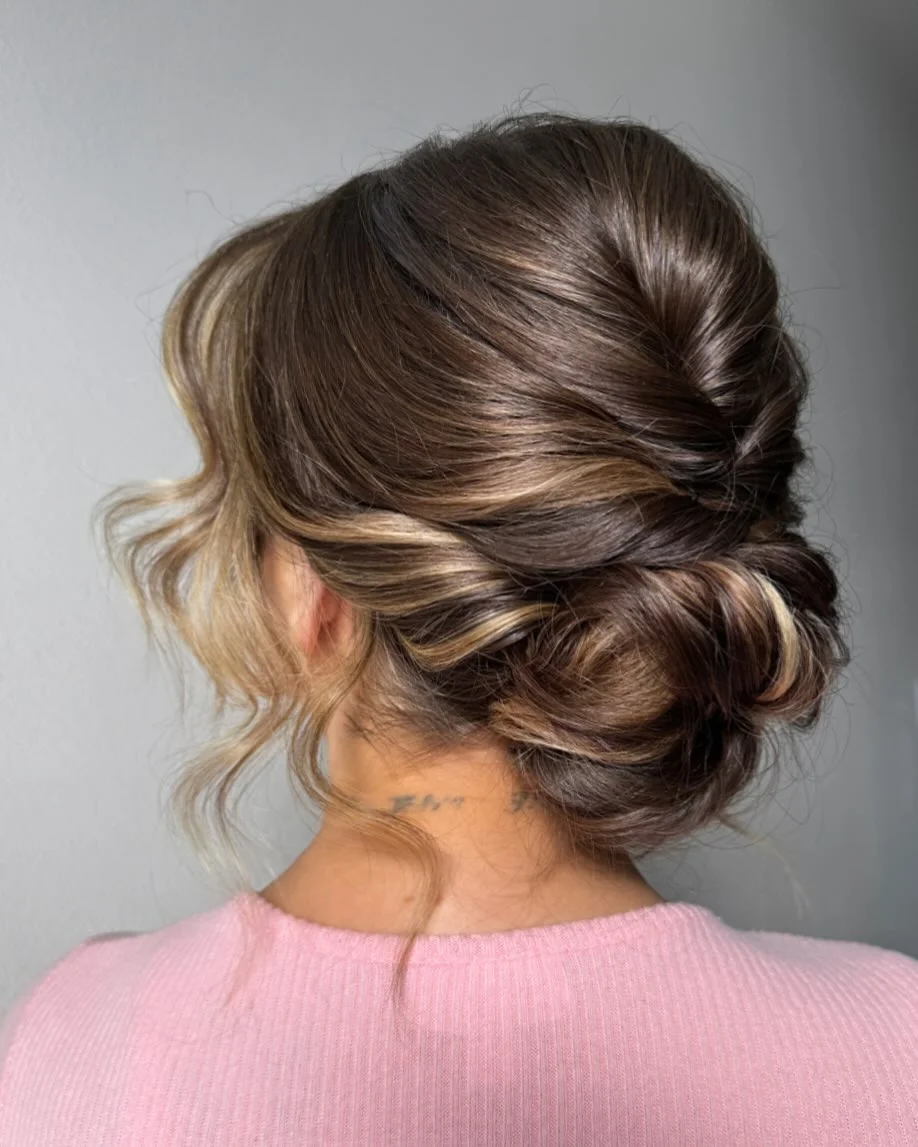 quick summer bun hairstyles 2026 Soft Twisted Bun With Face-Framing Blonde Ribbons