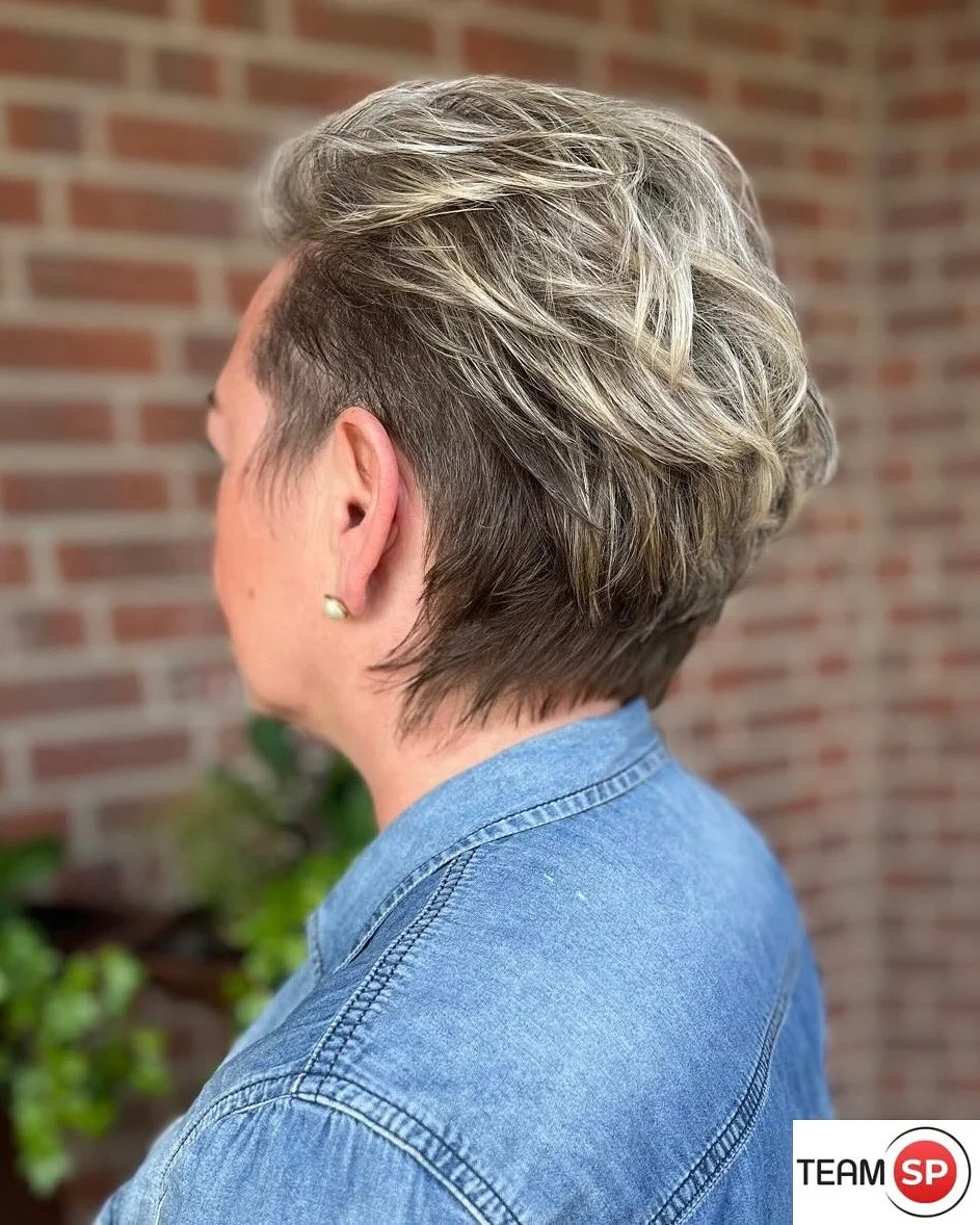 refined summer haircuts for women over 60 2026 Textured Silver Pixie With Undercut Detail