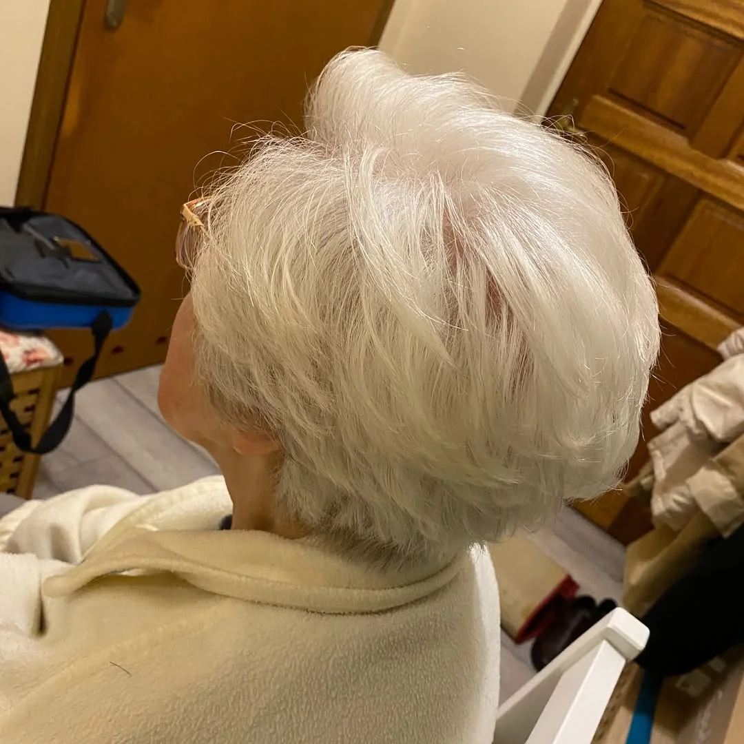 refined summer haircuts for women over 60 2026 Soft White Volume Layers With Feathered Texture