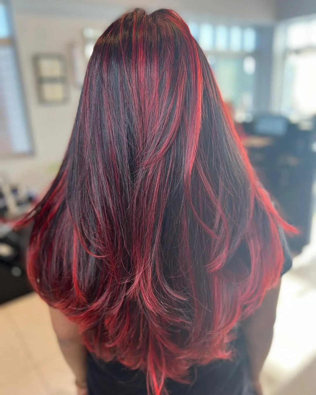 salon summer haircuts for medium hair 2026 Bold Red Layered Length with Statement Contrast