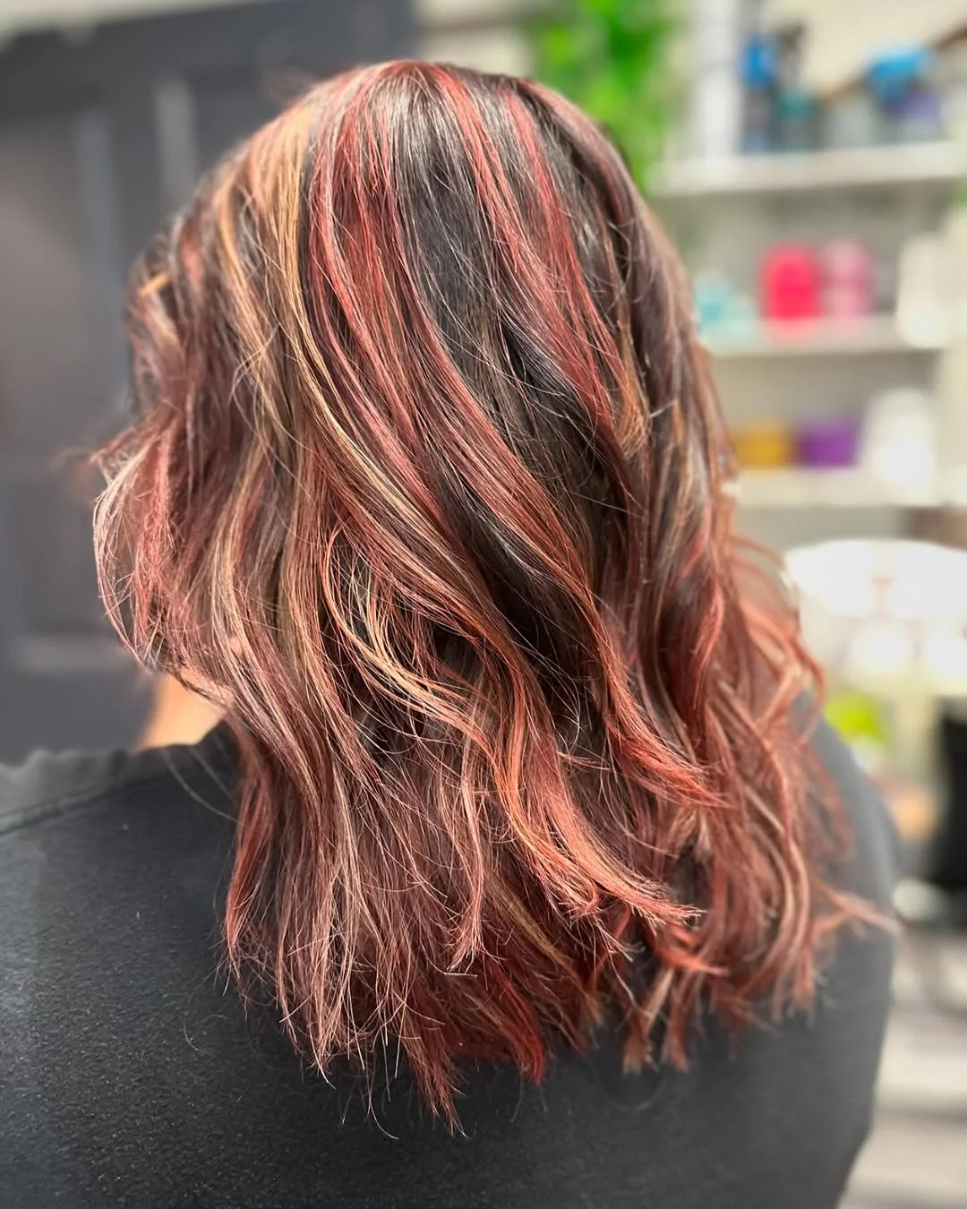 salon summer haircuts for medium hair 2026 Textured Auburn Waves with Dimensional Highlights