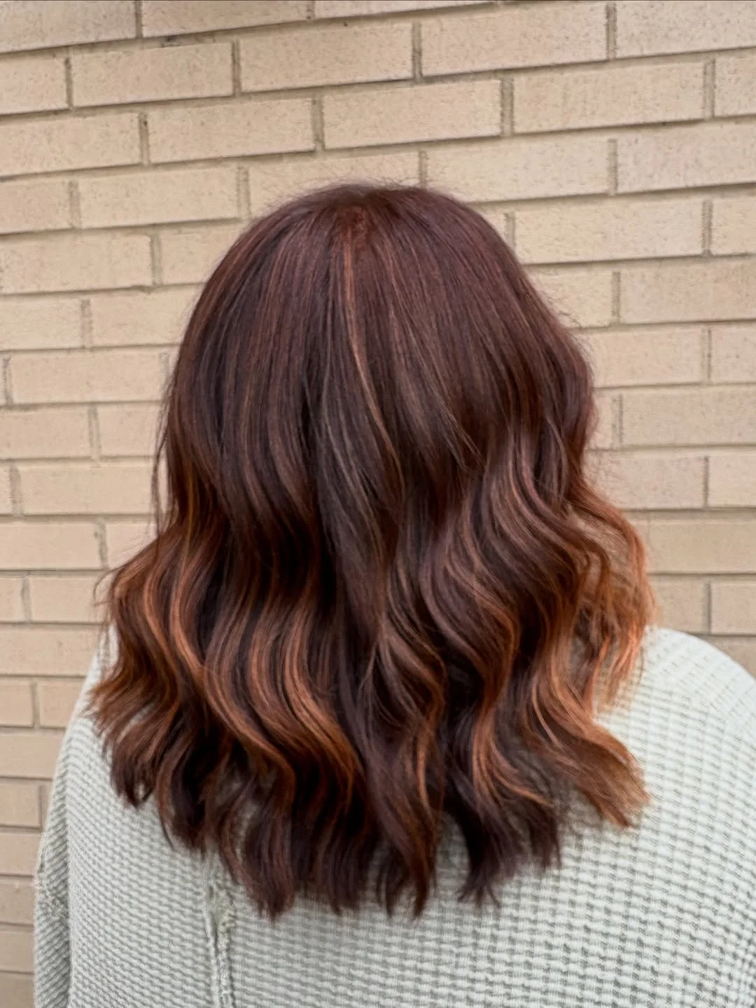salon summer haircuts for medium hair 2026 Rich Brunette Waves with Subtle Copper Glow