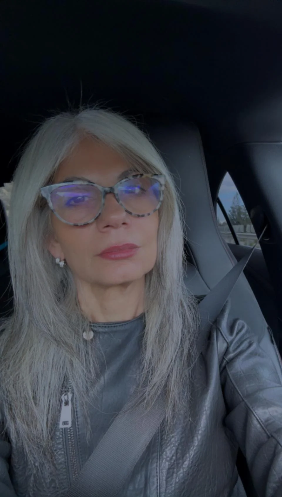 salon summer haircuts for women over 50 2026 Long Silver Layers With a Modern Center Part
