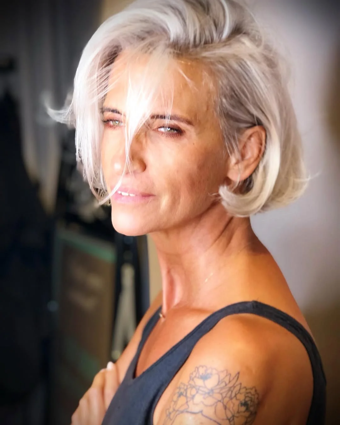 salon summer haircuts for women over 50 2026 Short White Blonde Bob With Dramatic Side Volume