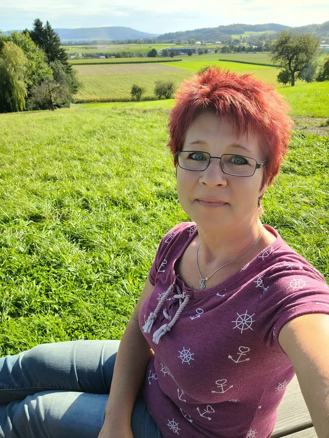 salon summer haircuts for women over 50 2026 Textured Crimson Pixie With Playful Summer Volume