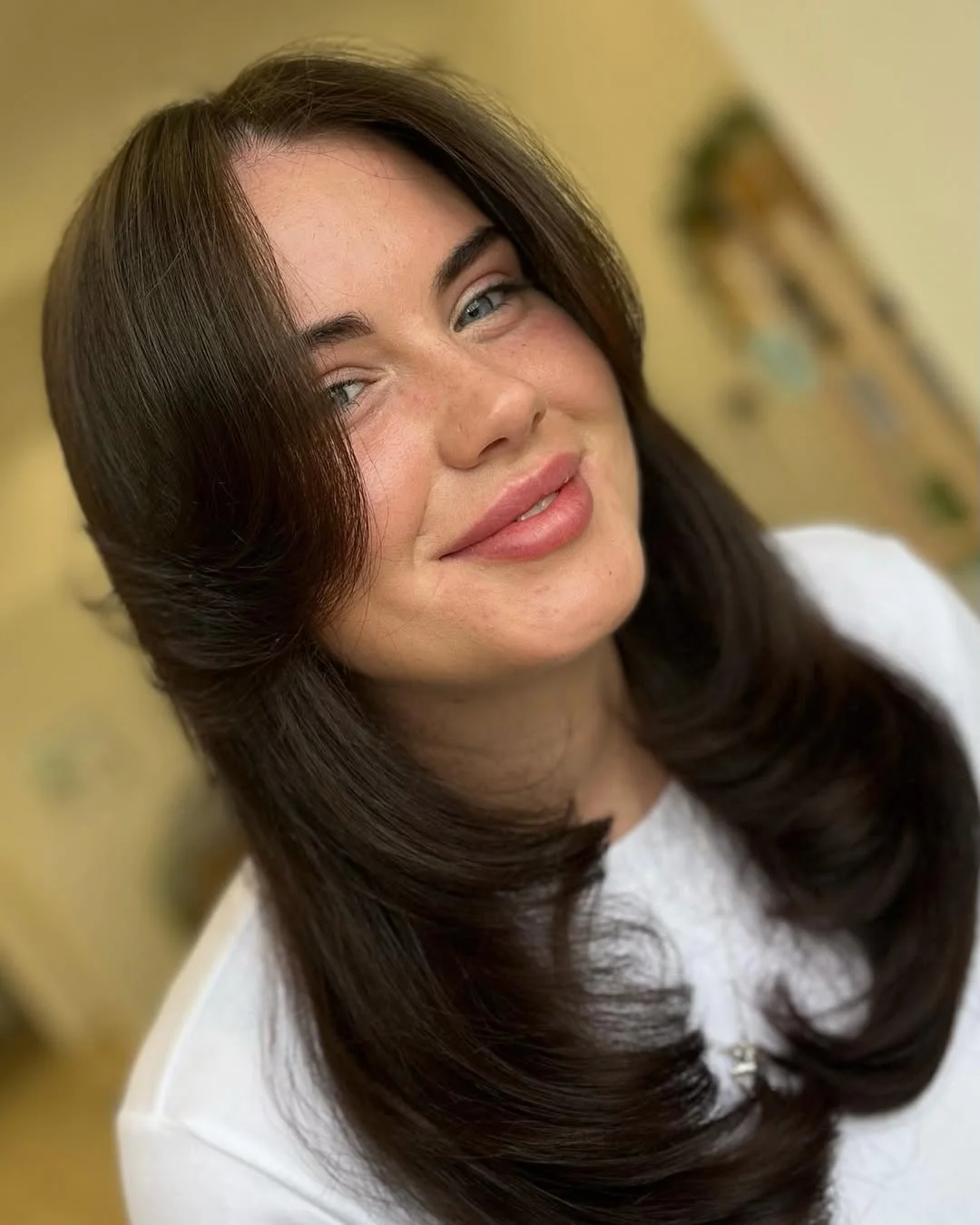 salon summer haircuts with bangs 2026 Soft Retro Flip With Minimal Curtain Framing