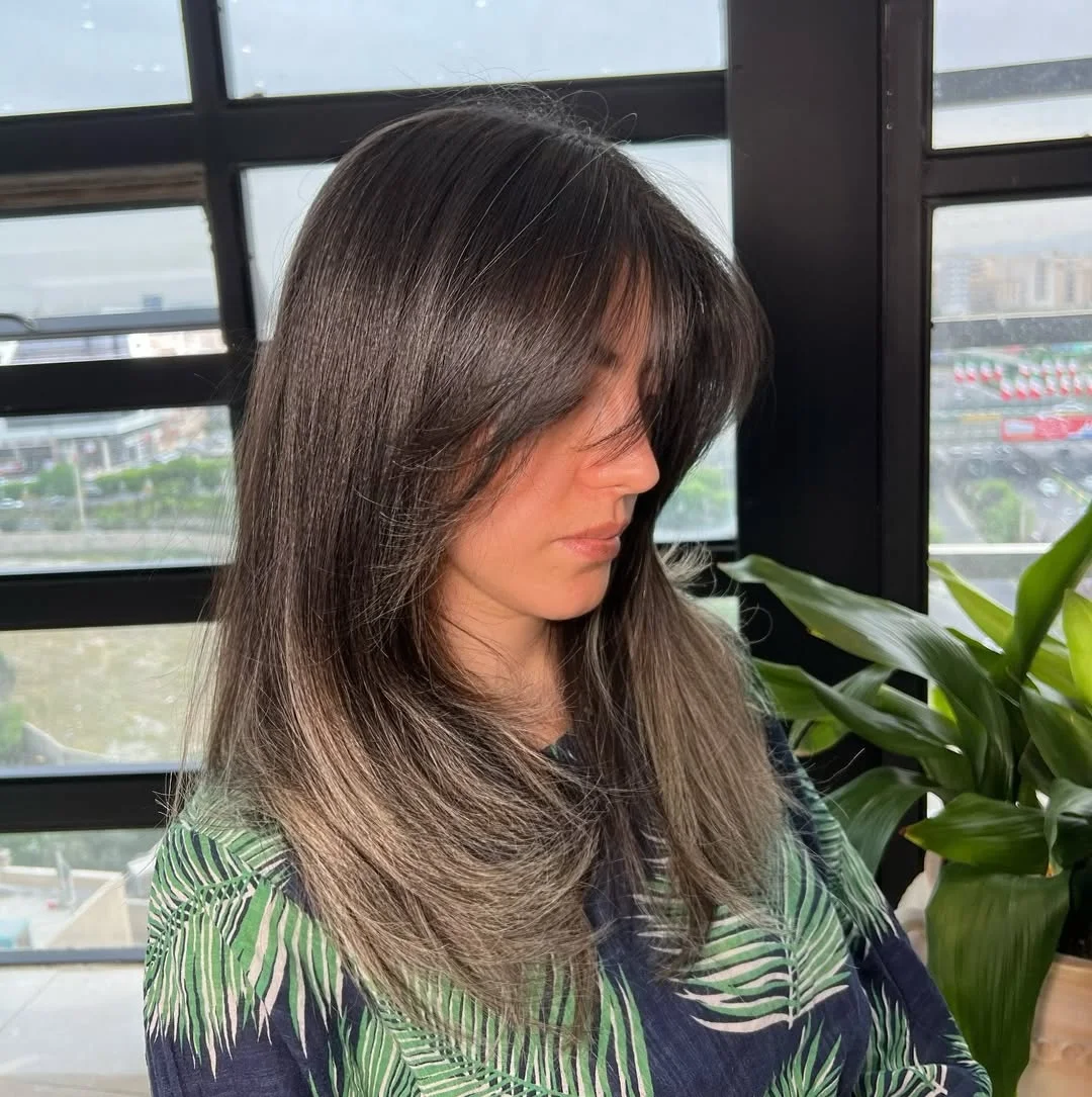 salon summer haircuts with bangs 2026 Smoky Brunette Layers With Feathered Curtain Shape