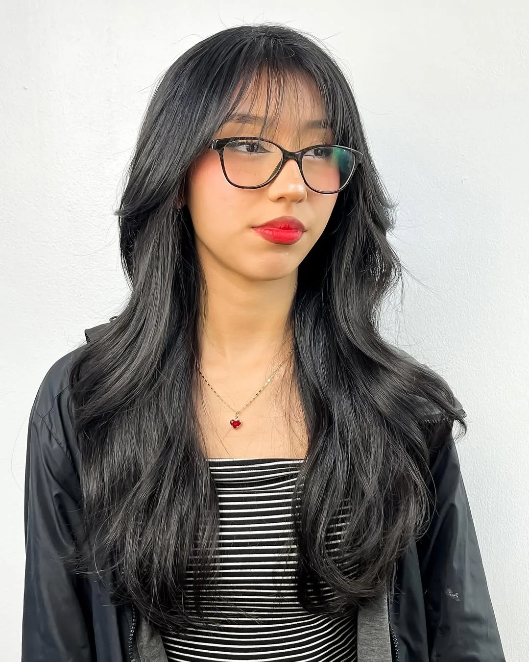 salon summer haircuts with bangs 2026 Glossy Black Layers With Airy Korean Inspired Bangs