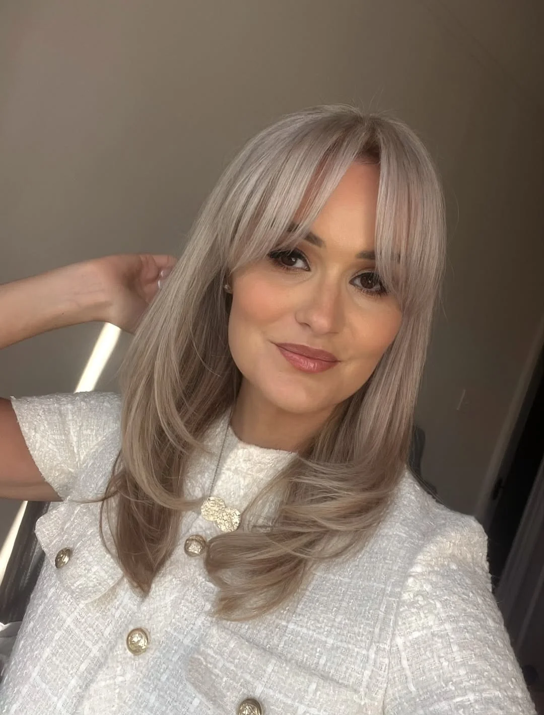 salon summer haircuts with bangs 2026 Champagne Layered Blowout With Curtain Movement