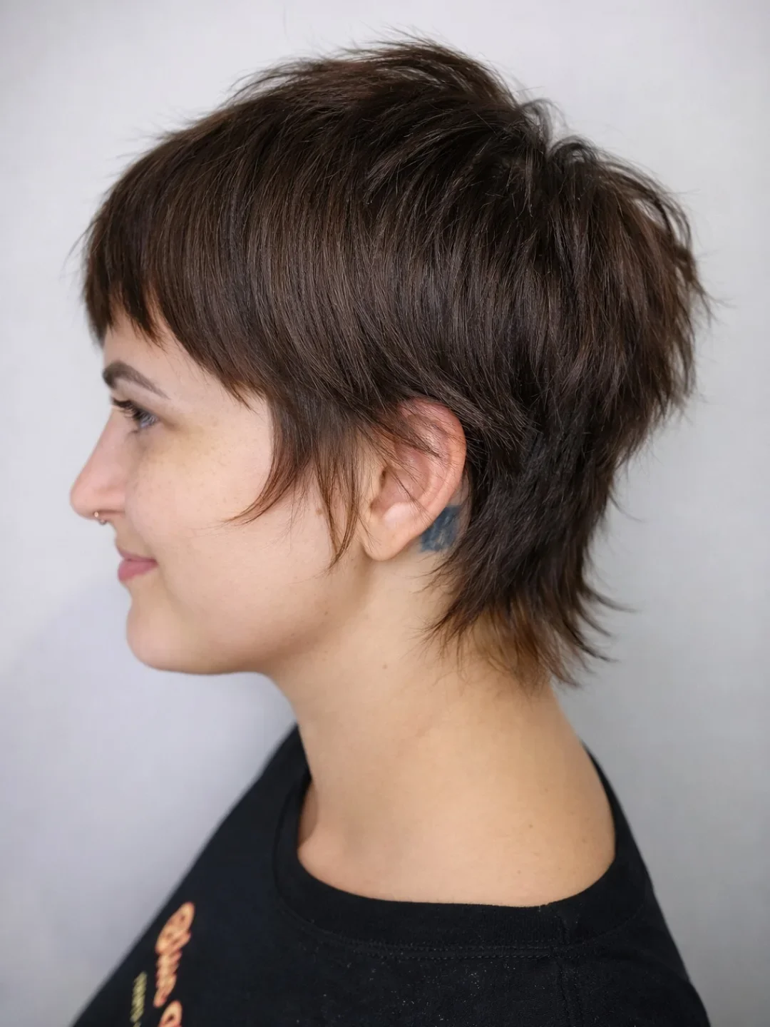 salon summer pixie haircuts 2026 Chocolate Brown Pixie Shag With Wispy Layers