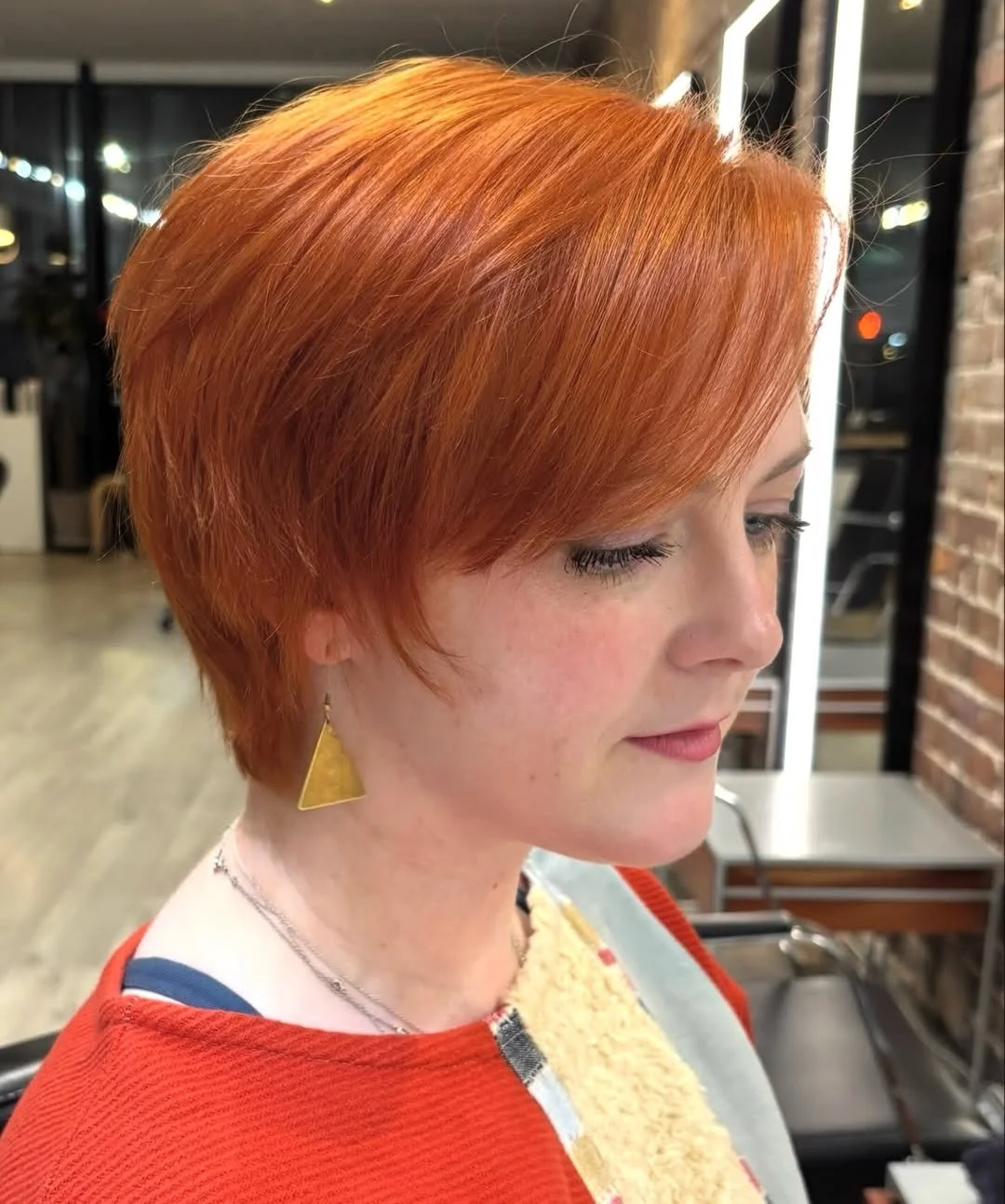 salon summer pixie haircuts 2026 Glossy Copper Pixie Bob With Side-Swept Layers