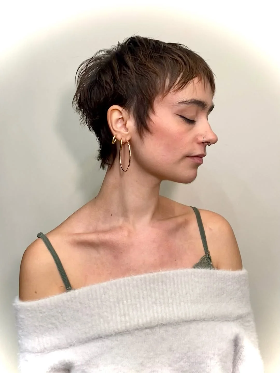 salon summer pixie haircuts 2026 Choppy Brunette Pixie With Soft Baby Layers