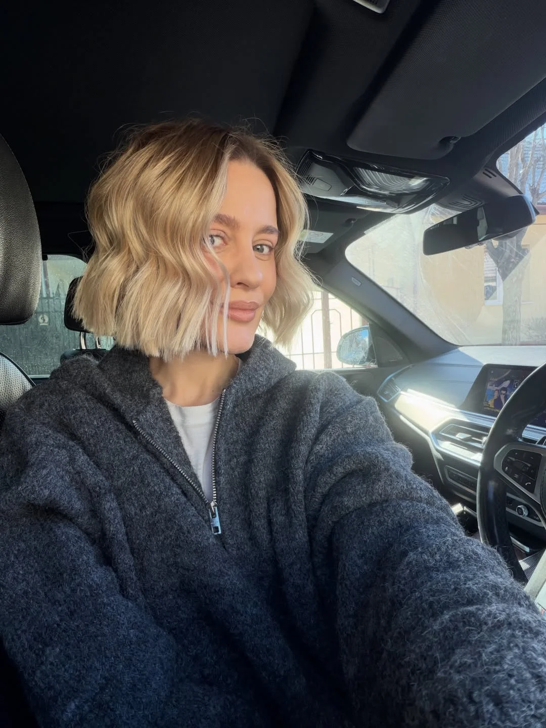 sassy summer short haircuts 2026 Soft Wavy Blonde Bob with Shadow Roots