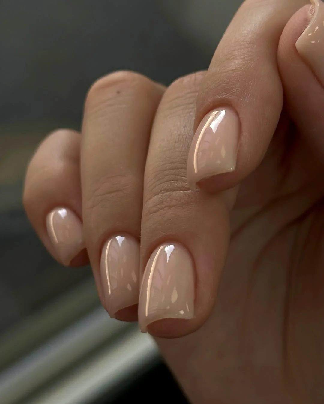 short gel nails summer 2026 Glossy Nude Nails That Quietly Match Everything