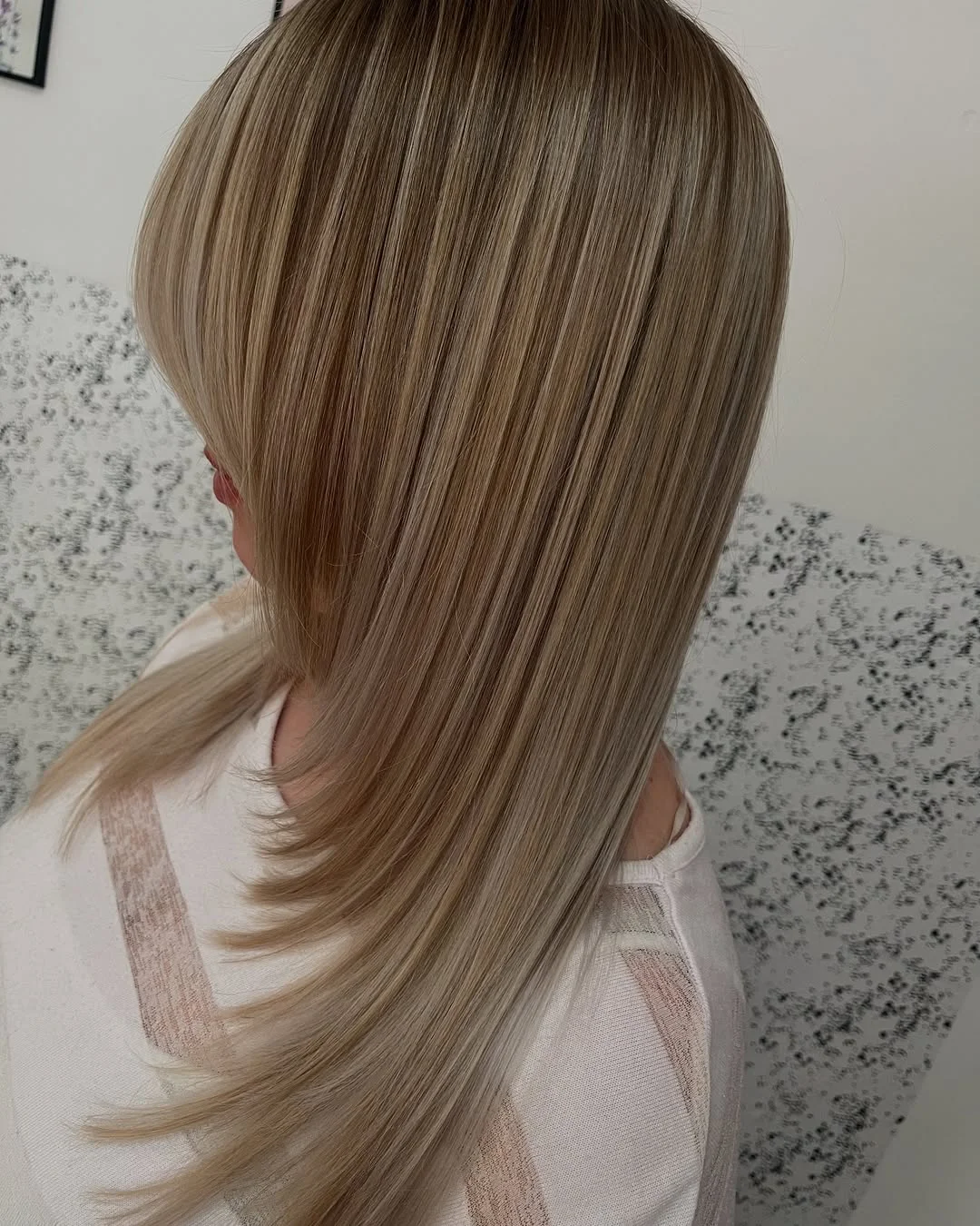 stylish summer haircuts for plus size women 2026 Feathered blonde layers with airy movement