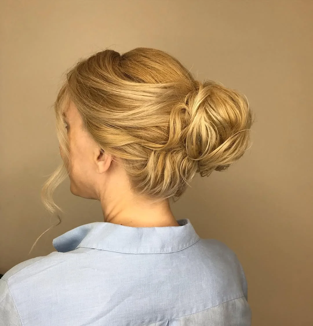 stylish summer haircuts for plus size women 2026 Low textured bun with soft volume