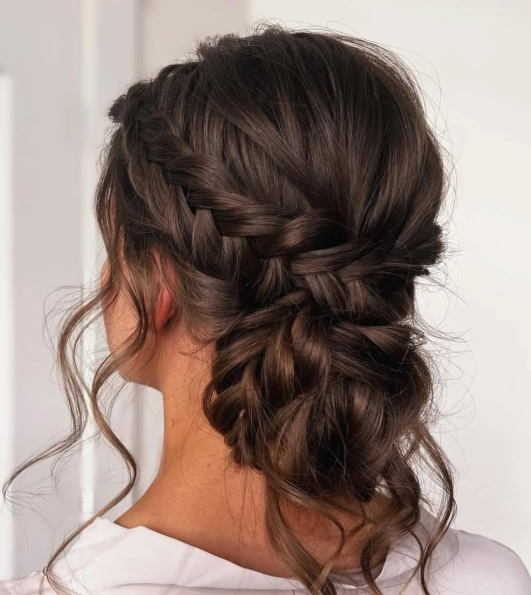 stylish summer updo hairstyles 2026 Soft Braided Low Updo With Loose Romantic Waves
