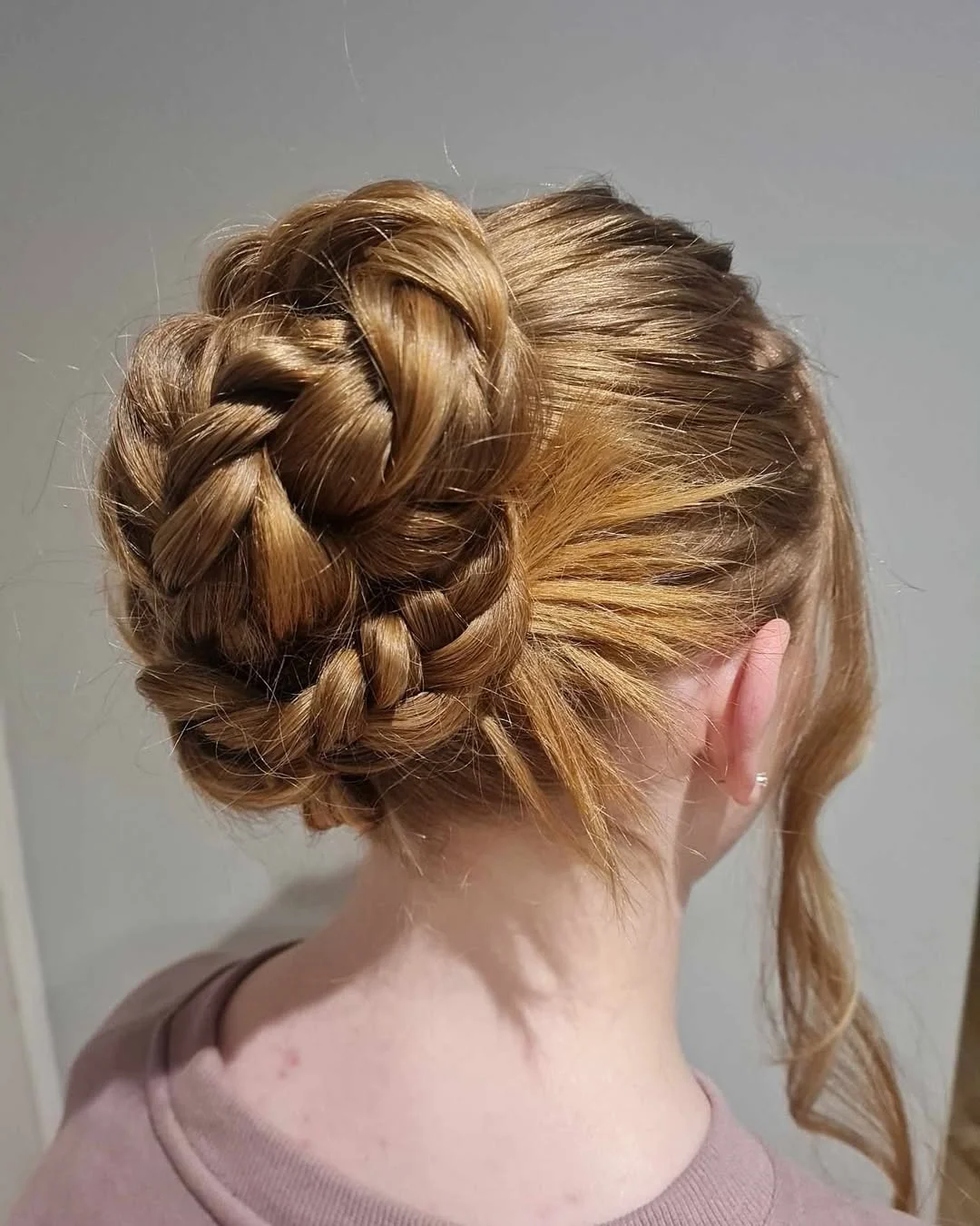 stylish summer updo hairstyles 2026 Textured Braided Bun With Golden Summer Dimension