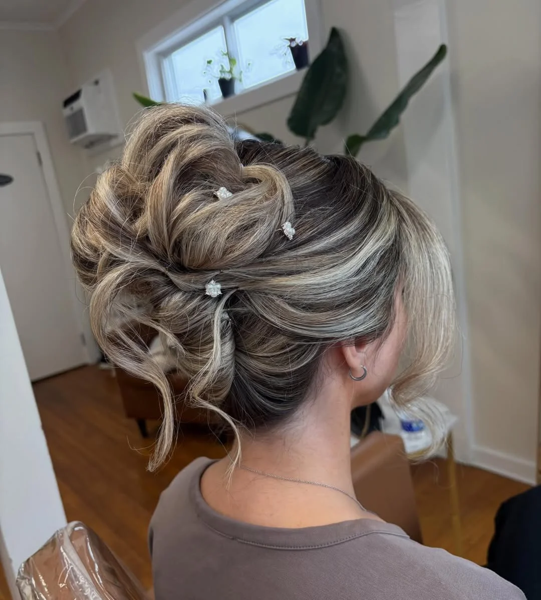stylish summer updo hairstyles 2026 Voluminous Blonde Textured Updo With Delicate Floral Pins