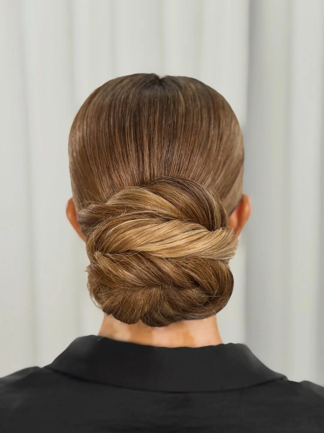 stylish summer updo hairstyles 2026 Elegant Twisted Low Bun With Glossy Dimension