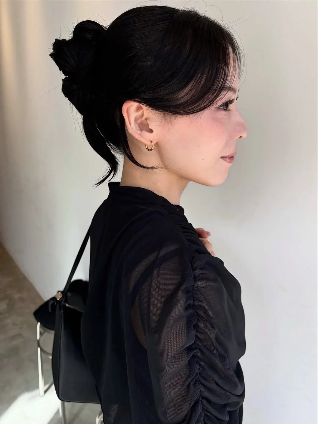 stylish summer updo hairstyles 2026 Minimal Sleek Bun With Soft Face-Framing Layers