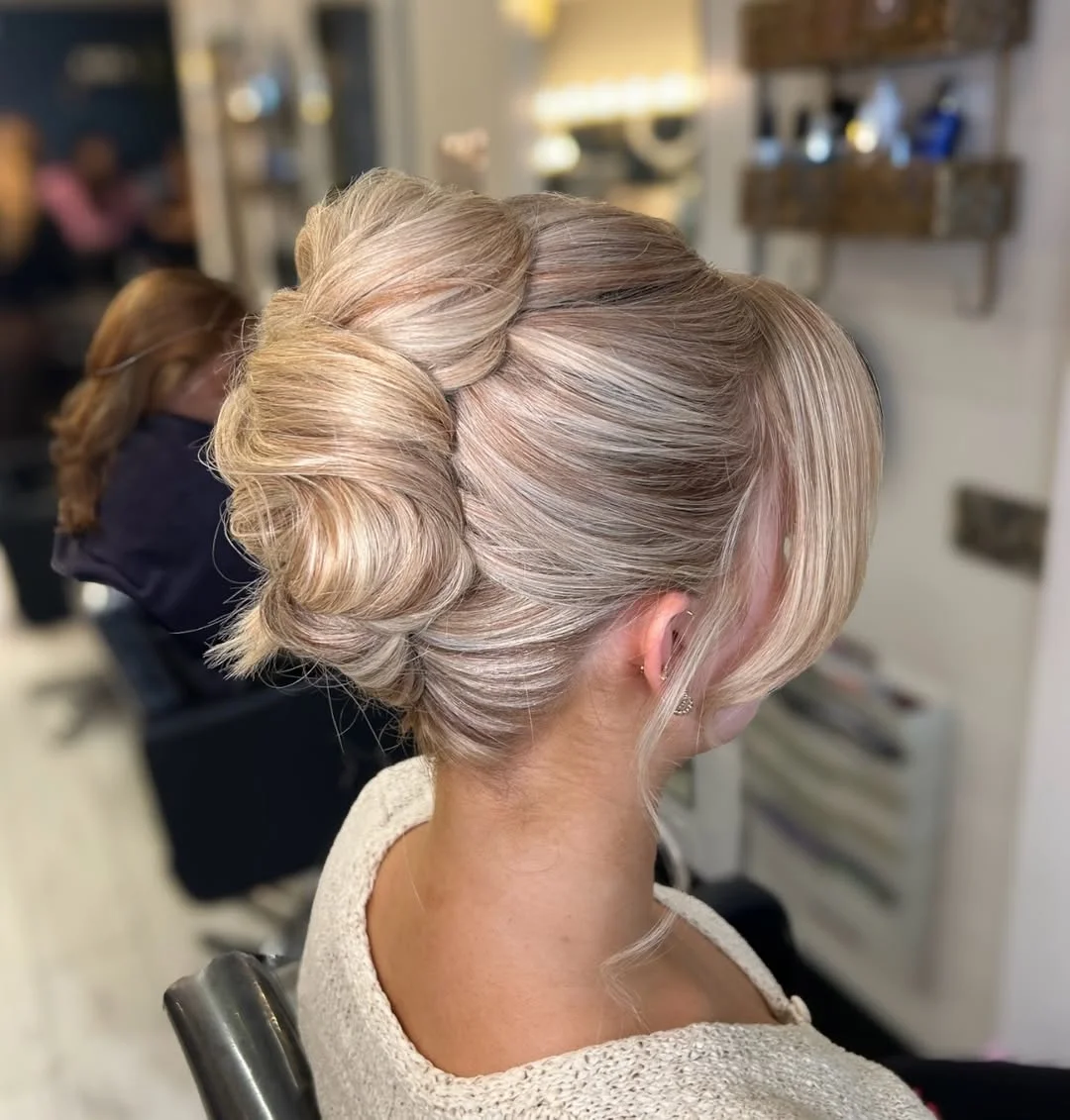stylish summer updo hairstyles 2026 Voluminous Blonde Bun With Soft Curtain Bangs
