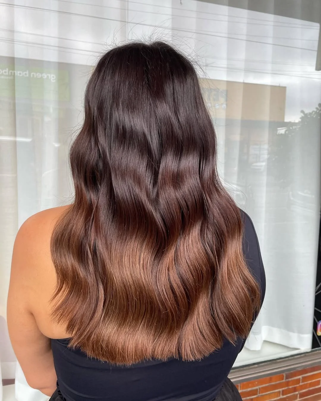 stylish summer wedding guest hairstyles 2026 Soft Brunette Waves with Glossy Dimensional Shine
