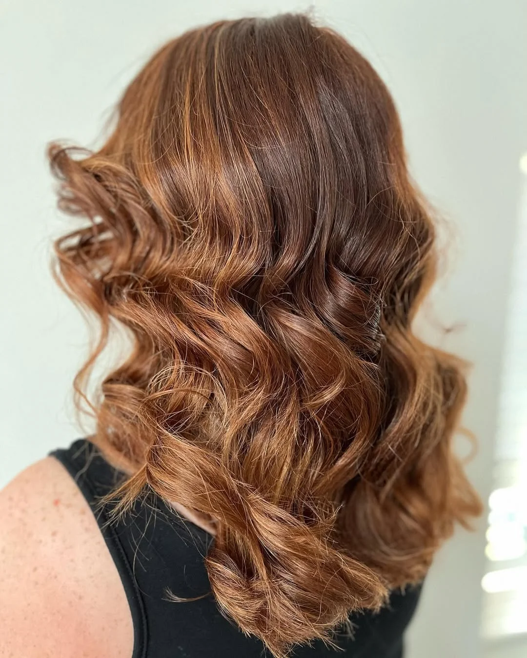 stylish summer wedding guest hairstyles 2026 Soft Copper Waves for Chic Summer Receptions