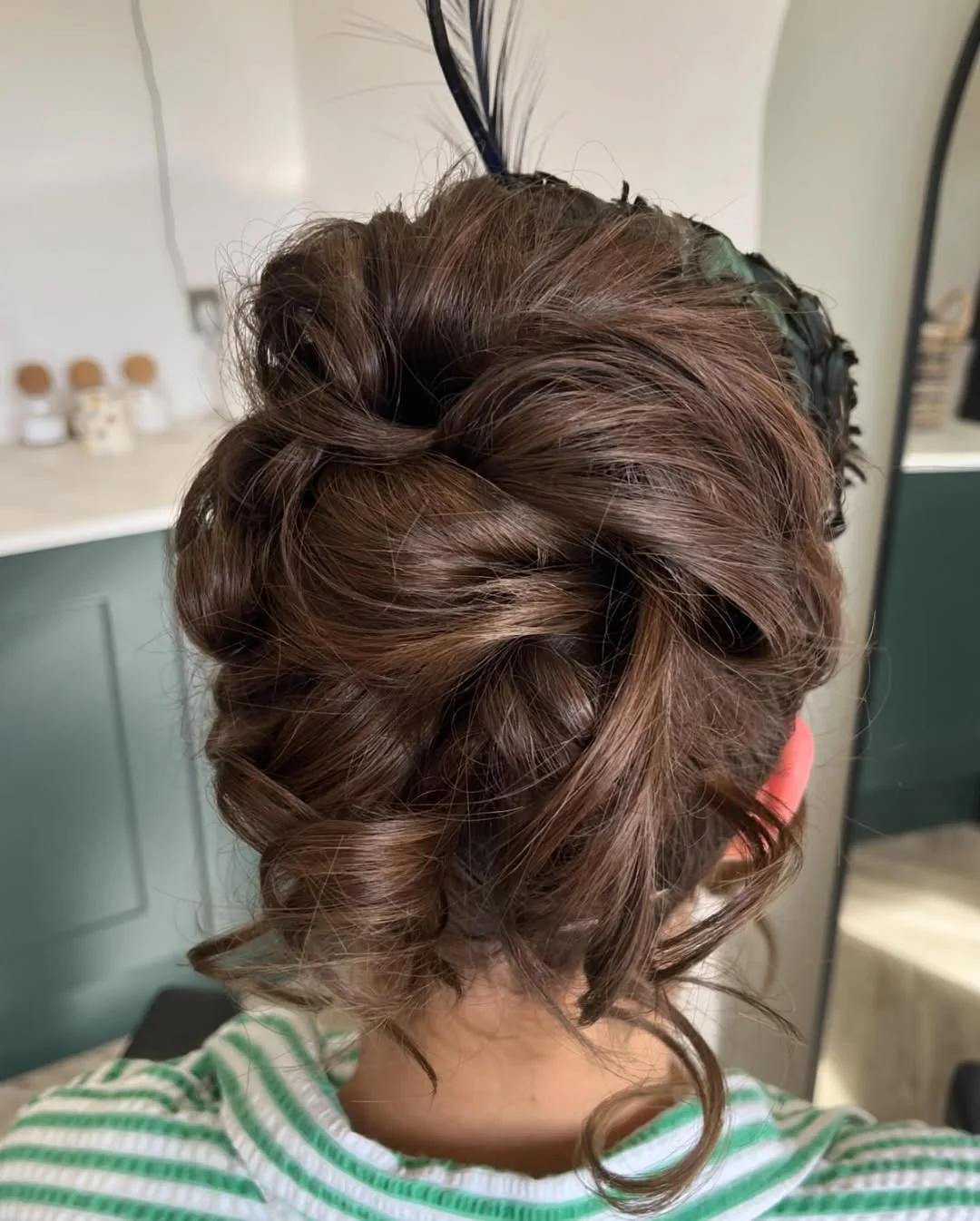 stylish summer wedding guest hairstyles 2026 Textured Brunette Updo with Soft Romantic Volume