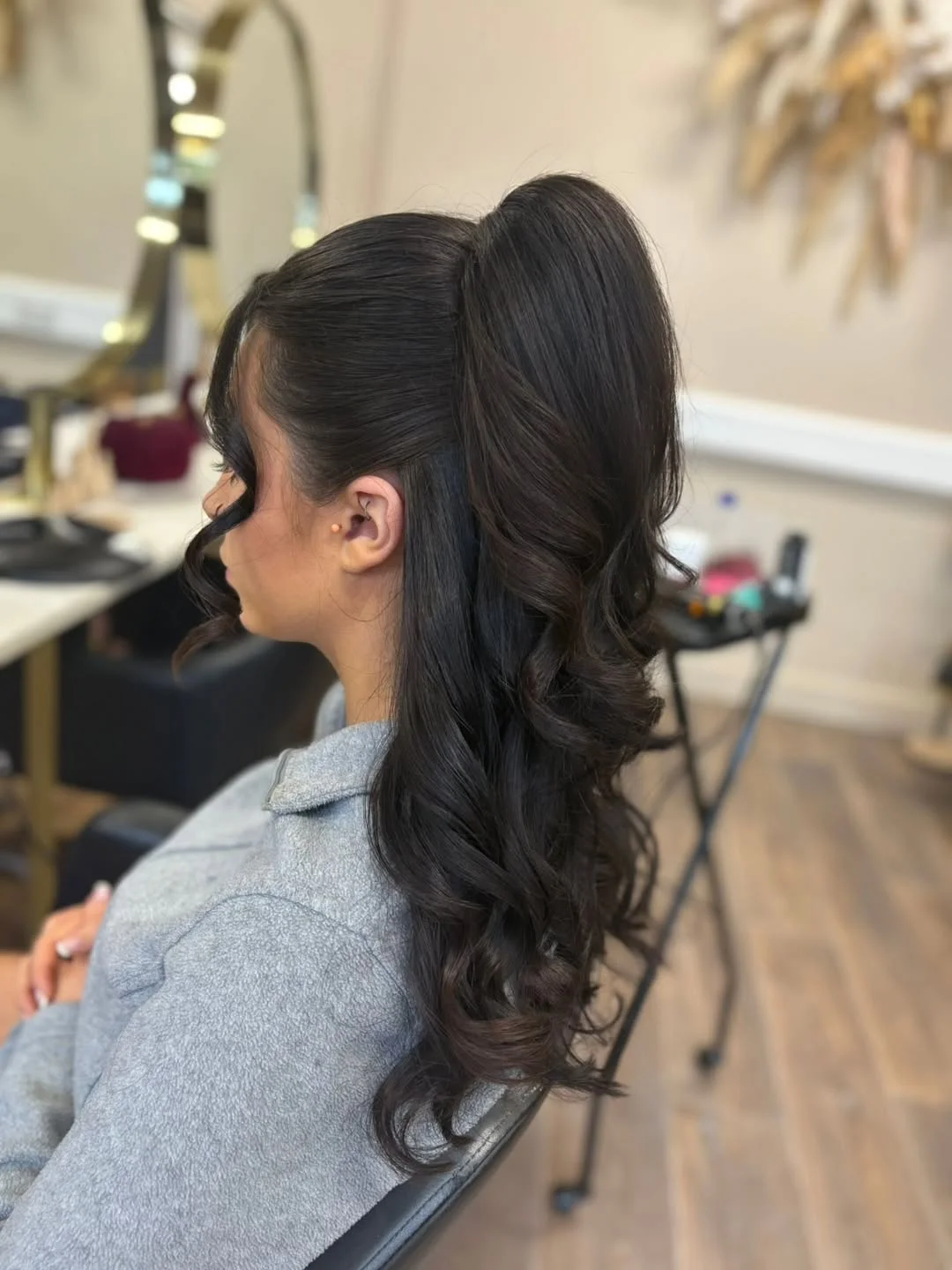 stylish summer wedding guest hairstyles 2026 Glossy High Ponytail with Romantic Waves