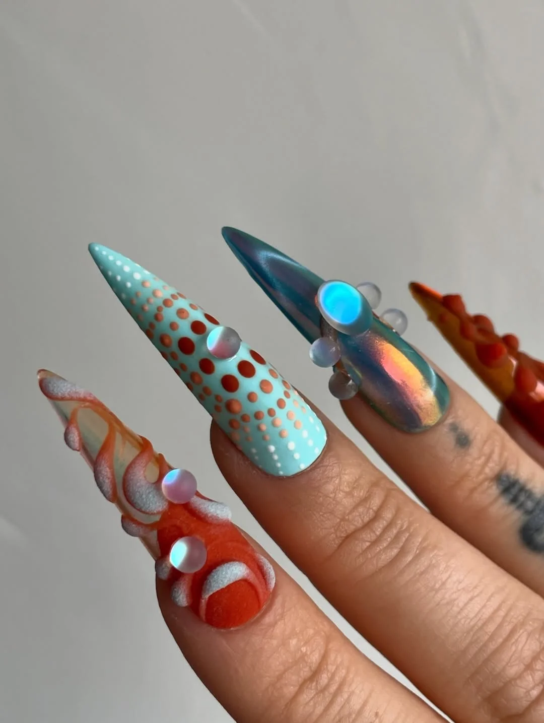 summer acrylic nails 2026 Retro Futurism Stiletto Nails With Chrome Details