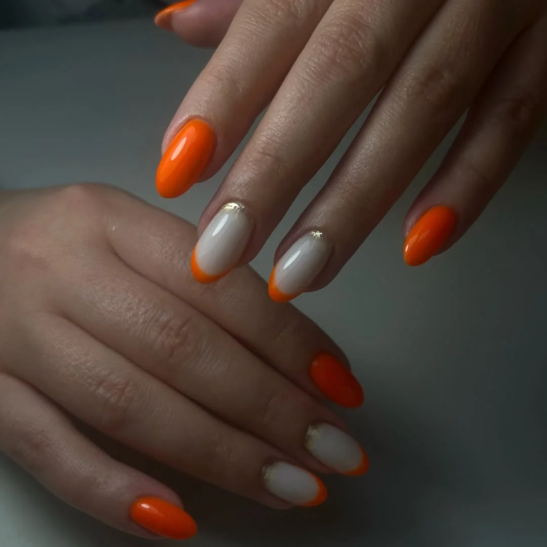 Summer beach nail ideas 2026 Sunset Orange French with Golden Touches