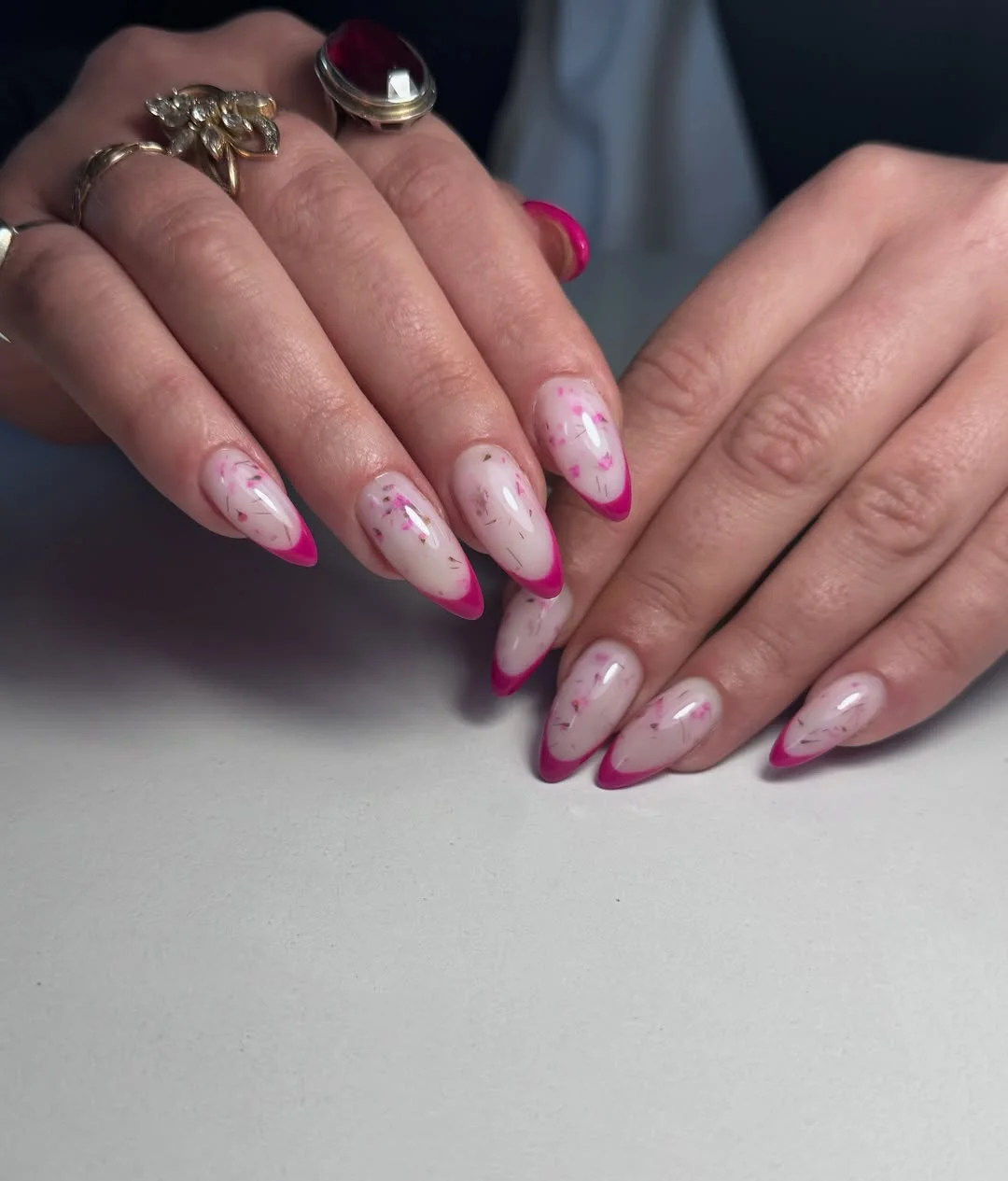 summer french tip nails 2026 Hot Pink French Tips With Floral Confetti Details