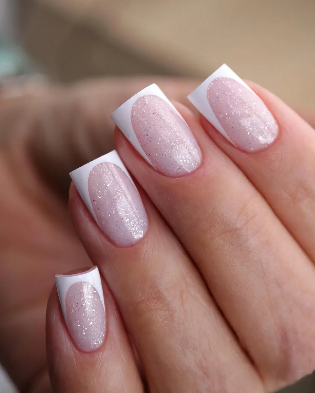 summer french tip nails 2026 Shimmery White French Tips With a Soft Pearl Glow