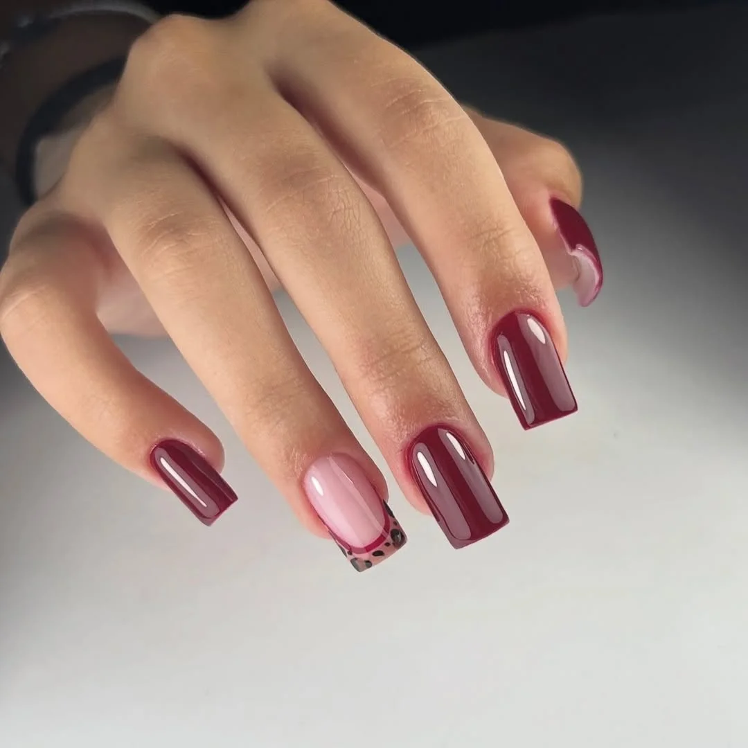 summer gel nails 2026 Glossy Burgundy Nails With A Minimal Leopard Accent