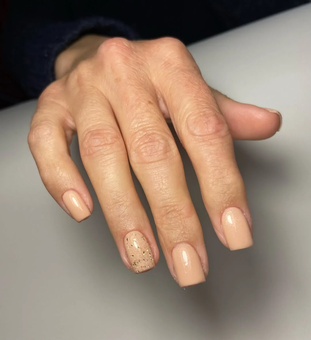 summer glitter nails 2026 Soft Nude With a Whisper of Golden Sparkle