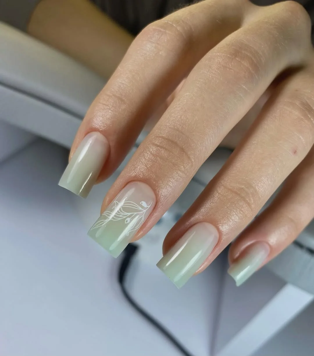 summer manicure color ideas 2026 Milky Sage Green Nails With Minimal Botanical Art